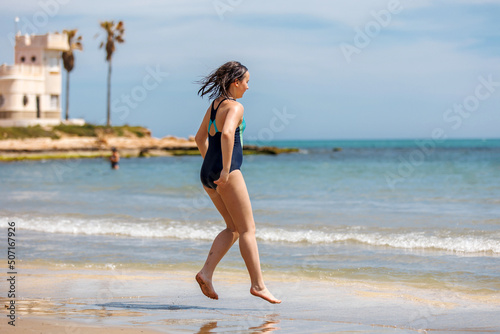 Teenage girl swimming in sea water