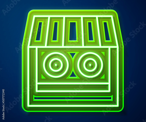 Glowing neon line Shooting gallery icon isolated on blue background. Shooting range. Vector