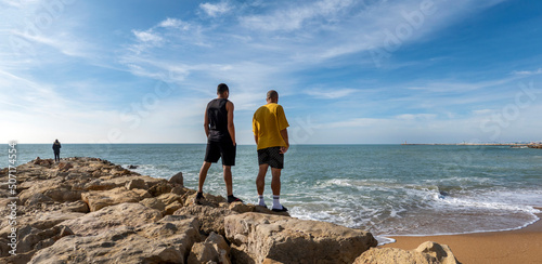 Photos people watch and relax on breakwater