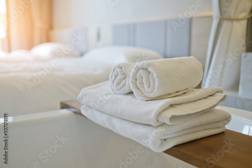 Fototapeta Naklejka Na Ścianę i Meble -  cleaning hotel, bath towel on white bed, room service 
