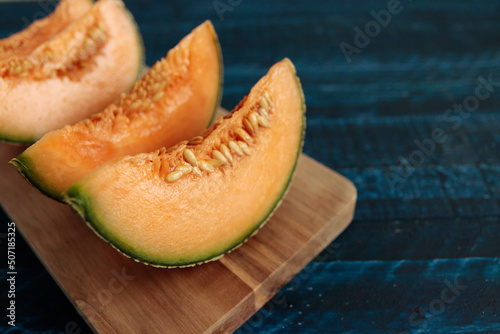 Cut pumpkin-like melon on the table