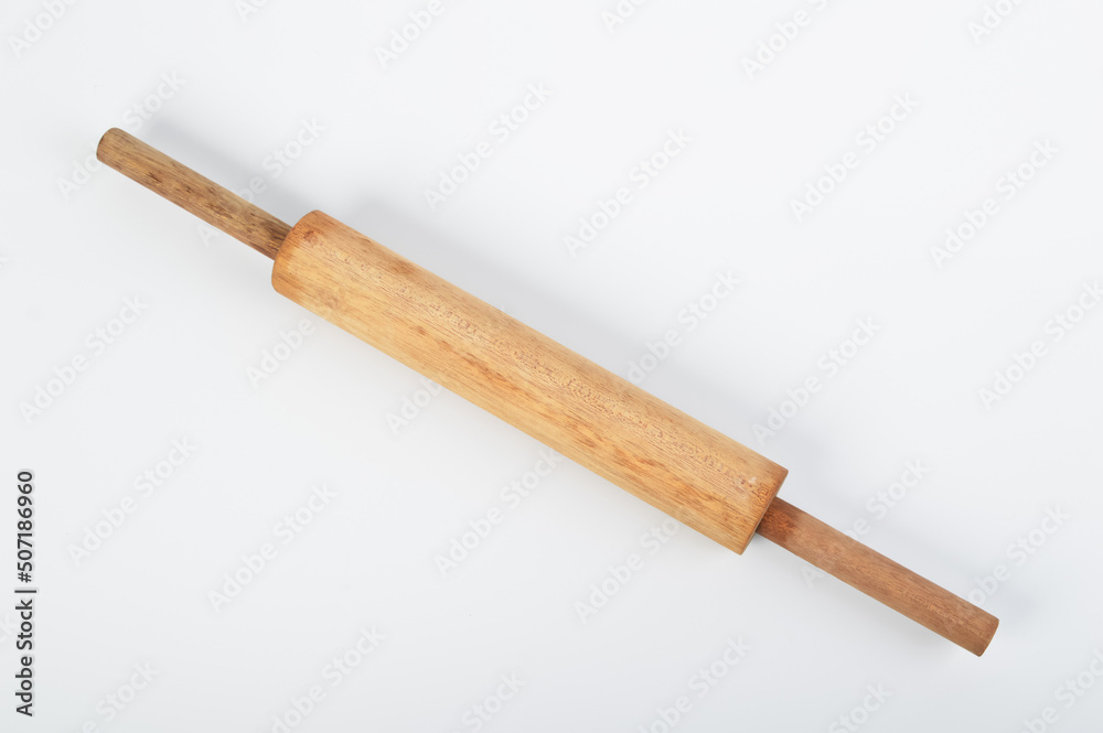 Wooden rolling pin for bread rolls isolated on a white background Wooden rolling pin for bread rolls isolated on a white background