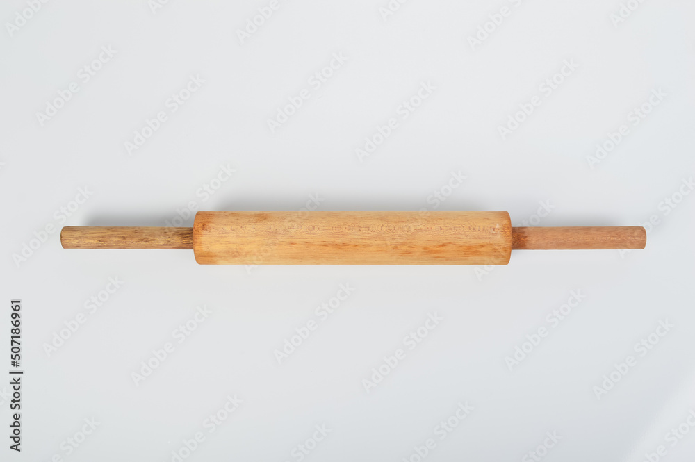 Wooden rolling pin for bread rolls isolated on a white background