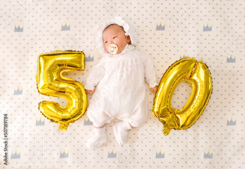 a 50-day-old baby, asian child