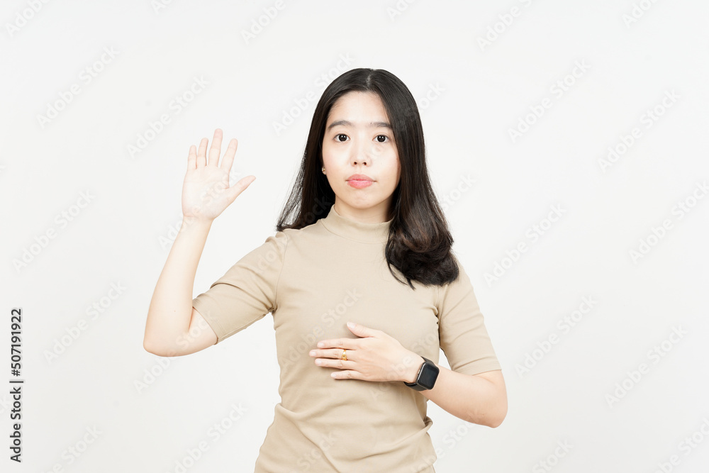 Swearing or Promise Gesture Of Beautiful Asian Woman Isolated On White Background Swearing or Promise Gesture Of Beautiful Asian Woman Isolated On White Background