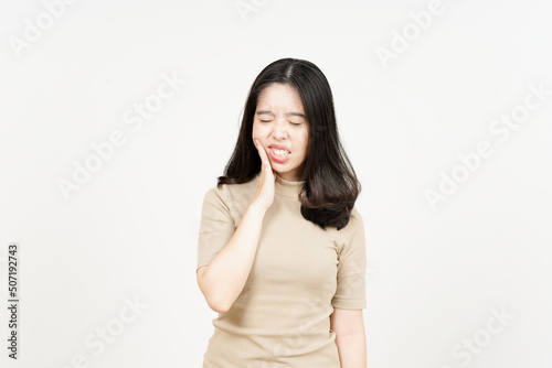 Suffering Toothache Of Beautiful Asian Woman Isolated On White Background © Sino Images Studio
