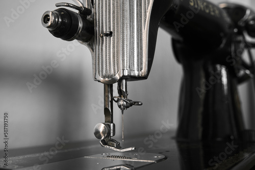 Antique sewing machine. Old sewing machine details. Vintage tailor sewing machine.