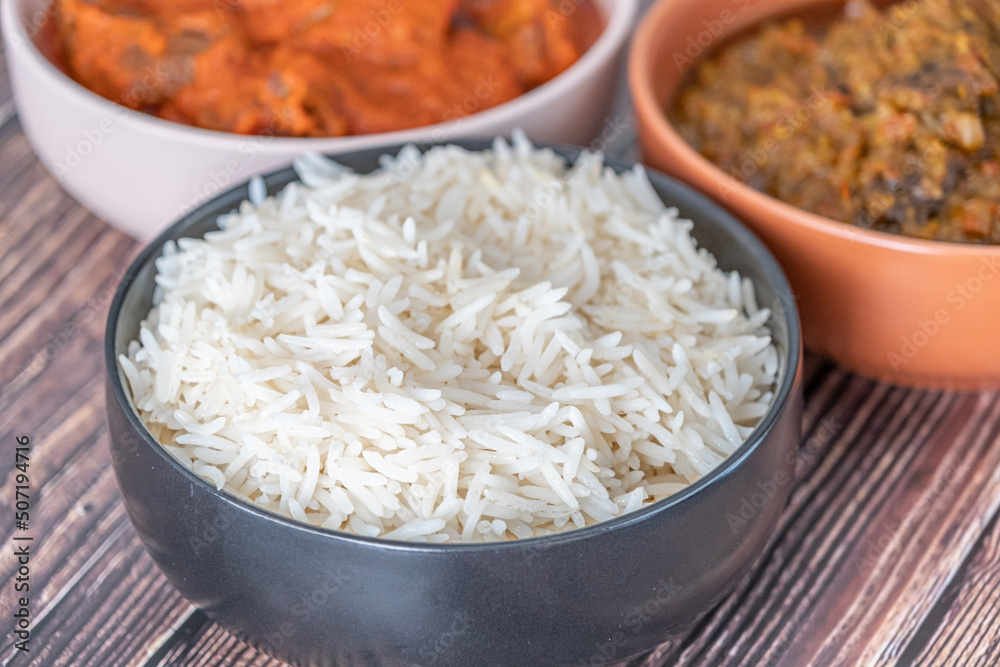 Bowl of rice served with Ofada and Pepper tomato stew Bowl of rice served with Ofada and Pepper tomato stew