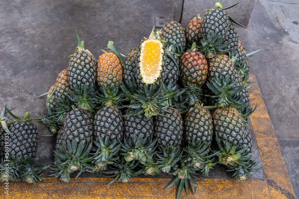 Large fruit market,Pineapple tropical fruit in the market. Large fruit market,Pineapple tropical fruit in the market.