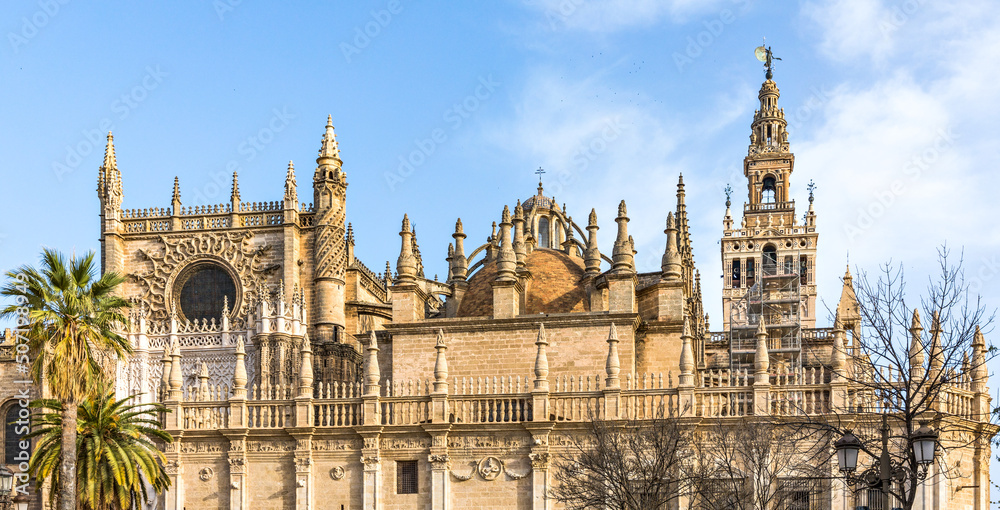 Naklejka premium Seville cathedral Giralda tower of Sevilla Andalusia Spain Church on sunny day.