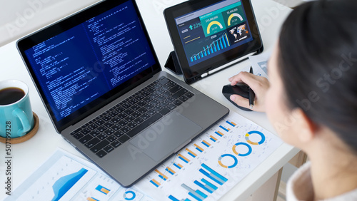 Back rear view of young asian woman, freelance data scientist work remotely at home coding programing on Big data mining, AI data engineering, IT Technician Works on Artificial Intelligence Project.