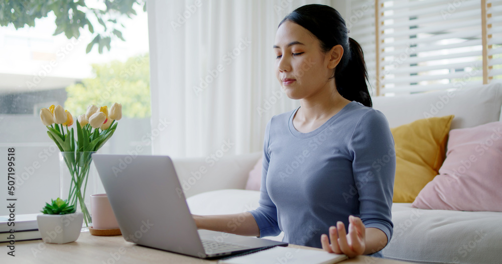 Workforce break time deep breath close eyes comfy workspace sit smile easy on floor relax enjoy yoga at cozy sofa couch help boost power energy in work at home office for asia people young teen girl. Workforce break time deep breath close eyes comfy workspace sit smile easy on floor relax enjoy yoga at cozy sofa couch help boost power energy in work at home office for asia people young teen girl.
