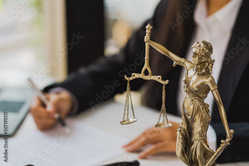 фотографія Lady of justitia with lawyer woman working with contract.