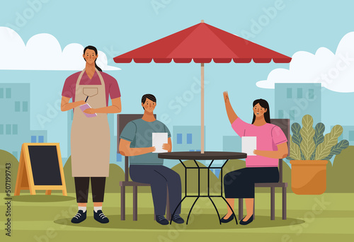 couple and waiter in restaurant