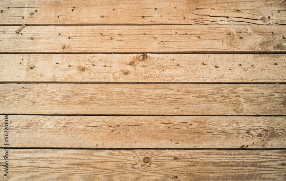 Fototapeta premium old brown wooden house wall background There are rough cracks for the wallpaper.