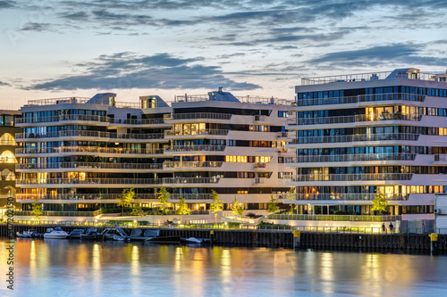 Modern apartment buildings at the river Spree in Berlin at dusk © elxeneize