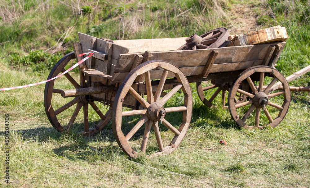 Old wooden cart with wooden wheels.