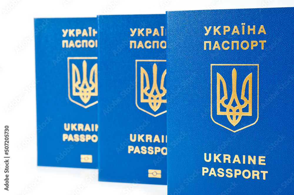 Fototapeta premium Passport of a citizen of Ukraine for traveling abroad is a document proving the identity of a citizen of Ukraine while crossing the state border of Ukraine and staying abroad.