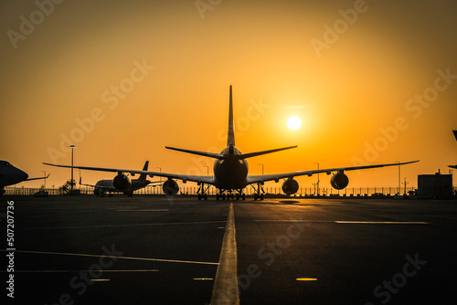 airplane in the sunset of Hong Kong airport