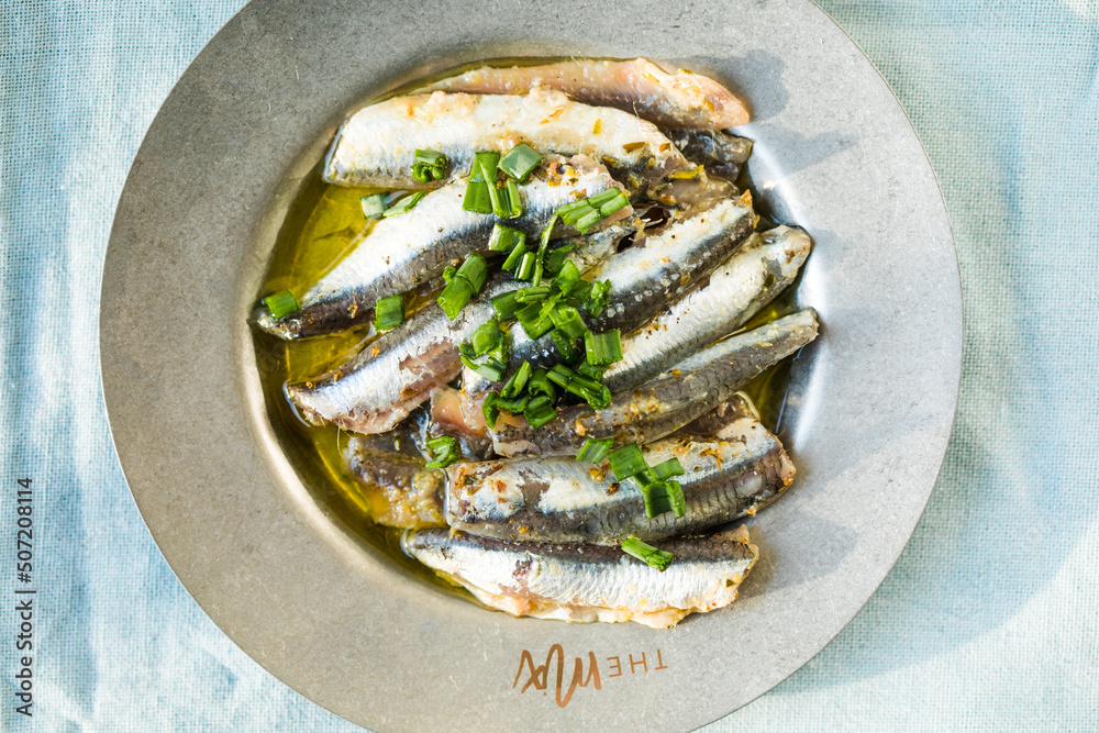 Fototapeta premium Traditional Spanish pintxos of Cantabrian anchovies in olive oil