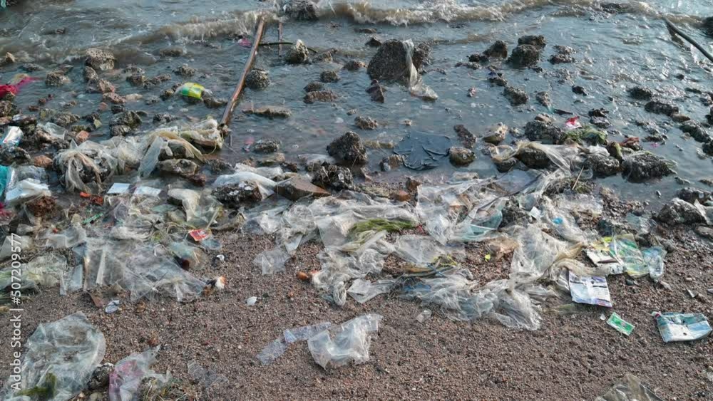 Beach pollution. Lots of Trash, plastic bottles and litter on the coastline.. Beach pollution. Lots of Trash, plastic bottles and litter on the coastline..