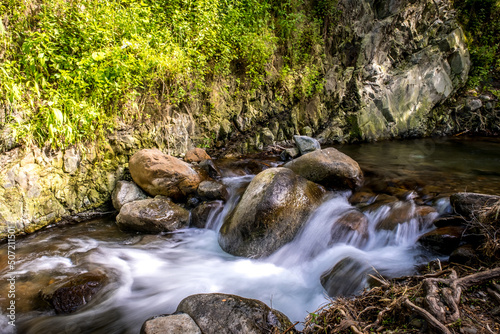 Long exposure landscape in the village of Kakopetria in Cyprus. Forest stream flows over rocks