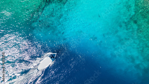 Aerial view of Scuba diving boat in the ocean at famous dive site for tiger shark in Fuvahmulah island, South Maldives. Marine Tourism and Nautical vessel industry