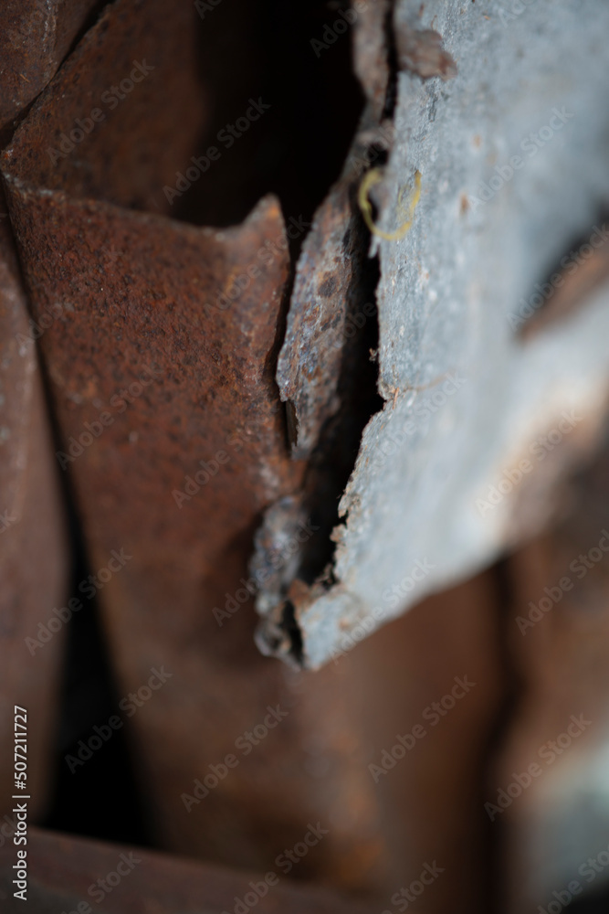 Rusty piece of metal shot in a recycle center Rusty piece of metal shot in a recycle center