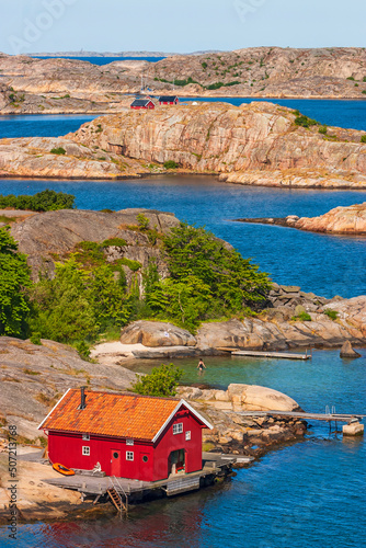 Fotobehang Idyllic archipelago view with a red boathouse
