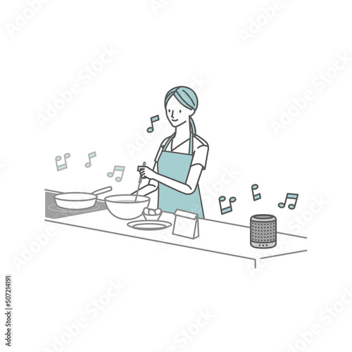スマートスピーカーで音楽を聴ききながら料理する女性