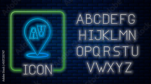 Glowing neon Rubber flippers for swimming icon isolated on brick wall background. Diving equipment. Extreme sport. Diving underwater equipment. Neon light alphabet. Vector