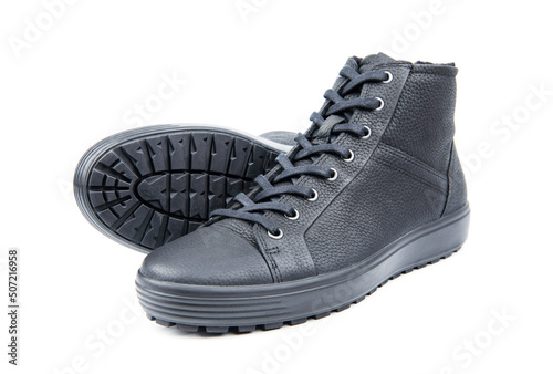 Men's sports leather boots on a white background. Men's sports winter boots with laces.