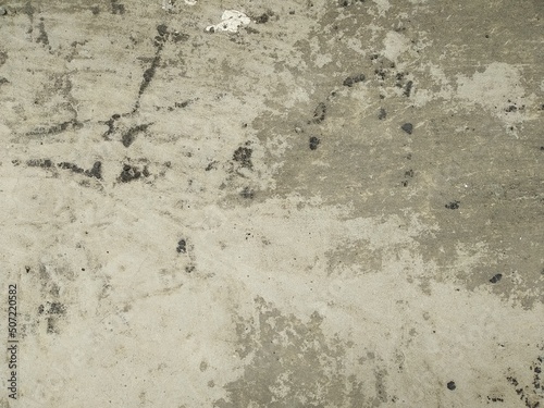 Floor concrete texture and abstract background.Texture with scratches and cracks.Wall fragment with scratches and cracks.old gray concrete texture wall.Abstract white and grey cement wall texture. © prateek