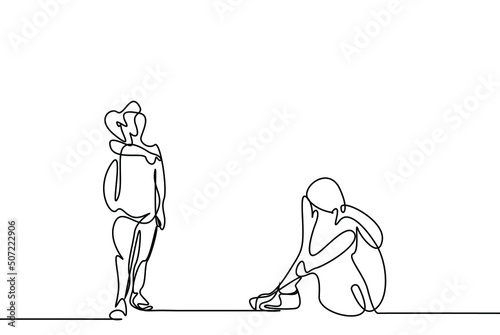 at school a boy with a backpack makes fun of a girl sitting on the floor and the girl cries