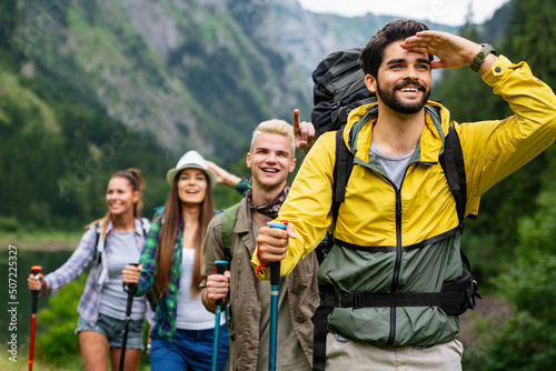 Fotografie Group of happy friends enjoying outdoor activity together