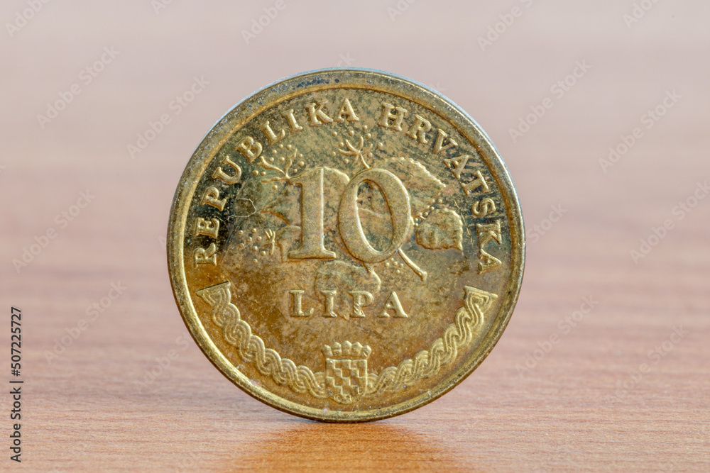 Croatian coin 10 lipa on wooden table. Croatian coin 10 lipa on wooden table.