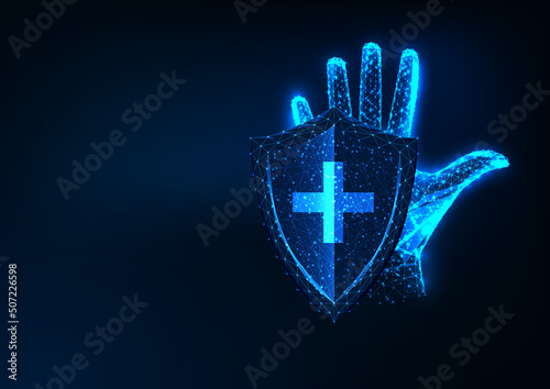 Futuristic health care, insurance, immunity concept with glowing hand, protection shield and cross