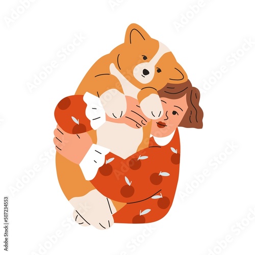 Happy kid holding, hugging cute chunky dog of corgi breed. Girl pet owner wit...