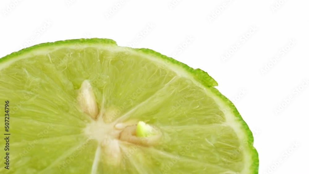 4K Rotation of a green lime. Top view, 360 degree rotation, close-up of a lemon in a cut. 4K Rotation of a green lime. Top view, 360 degree rotation, close-up of a lemon in a cut.