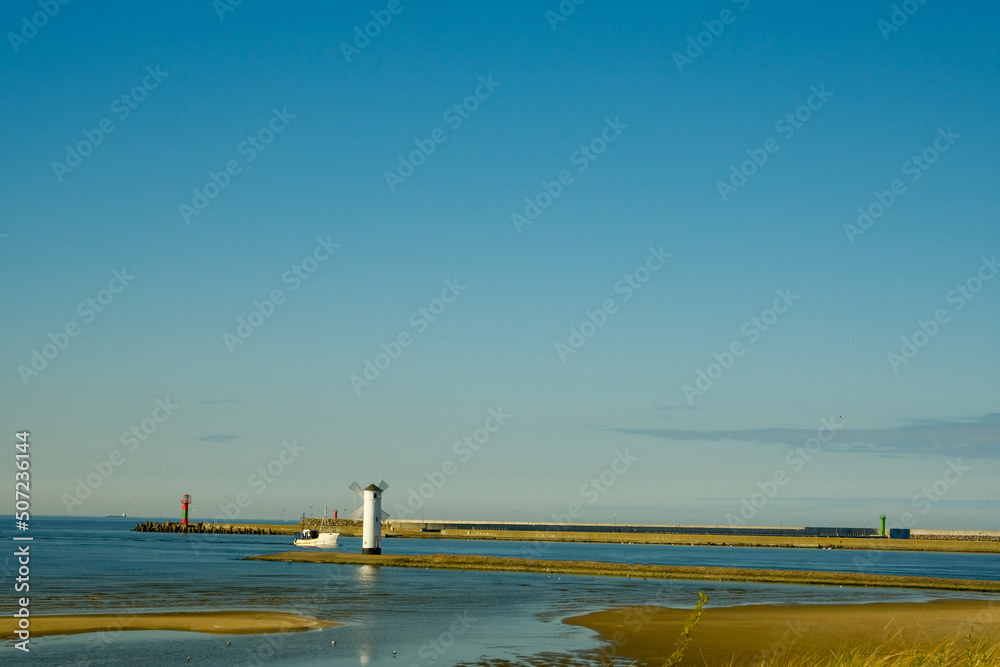 Scenic view of the old mill lighthouse at sunrise. Swinoujscie. Poland.lighthouse mill