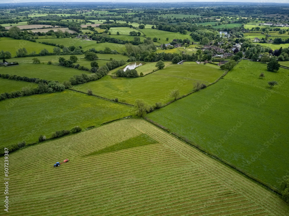 Mowing grass for silage in English countryside