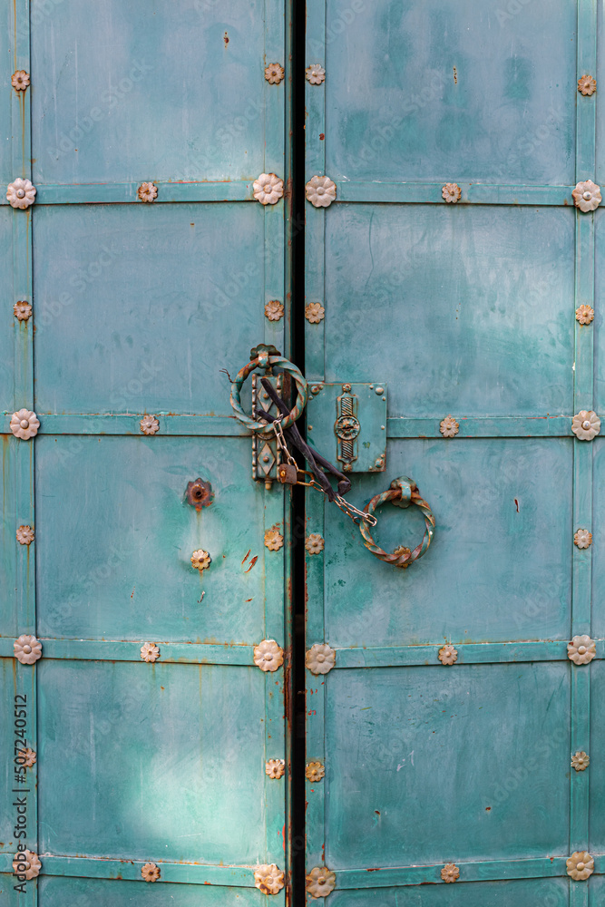 iron gates closed on a chain with a lock