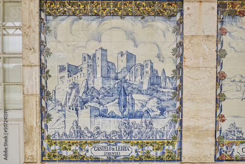 azulejos panel representing monuments and country scenes on the walls of Leiria station, Portugal