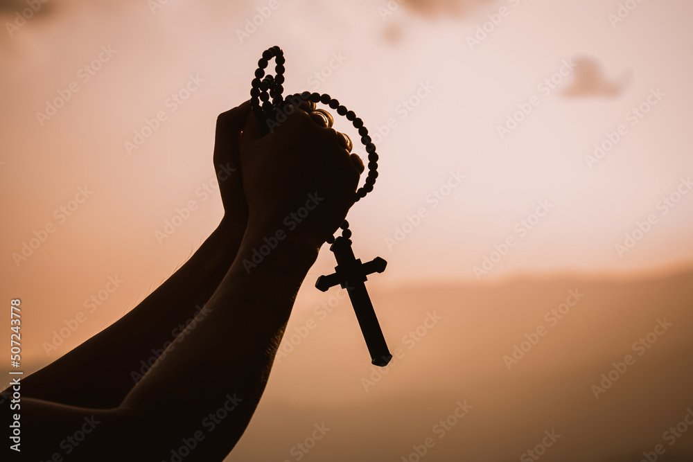 The human hand holds cross a christian religion faith concept Stock