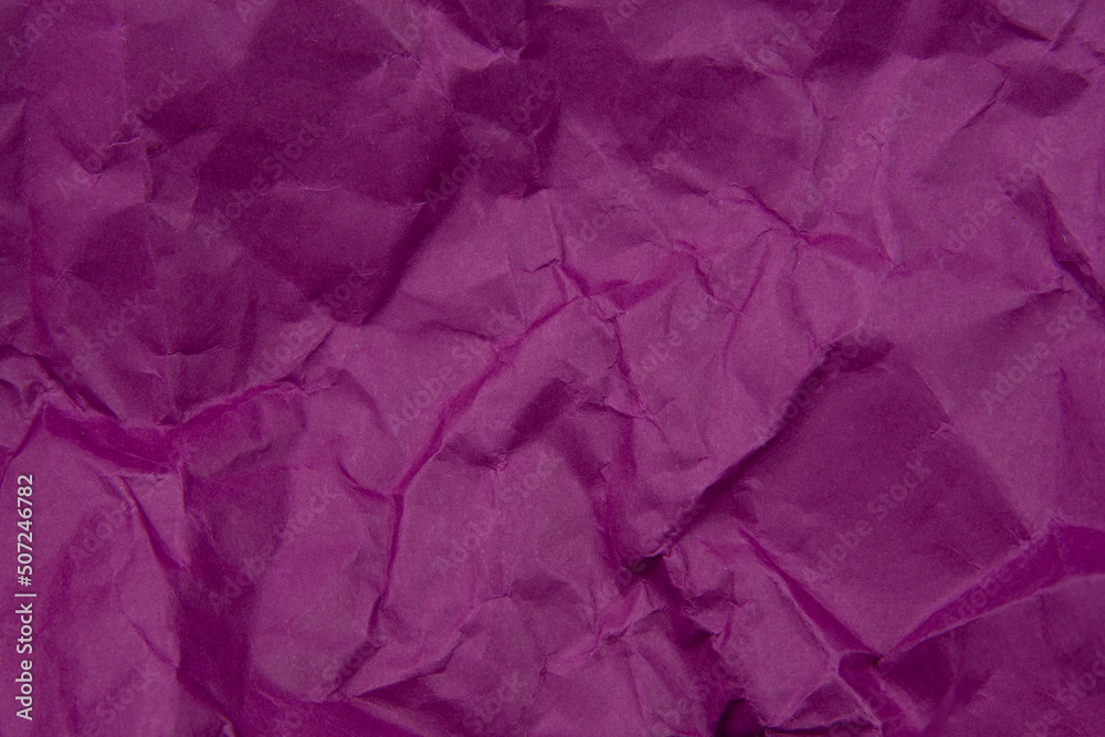 Crumpled violet paper craft textured background Crumpled violet paper craft textured background