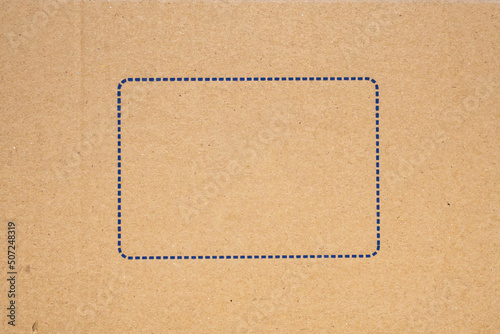 Old brown cardboard box paper texture with blue frame background