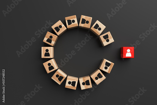 Fotografija Wooden blocks with people icons with one standing out from the crowd on black background