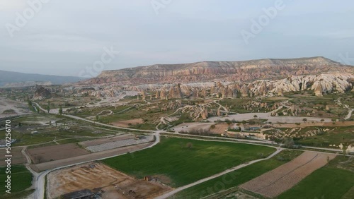 Aerial drone view over roadways through rural coutnryside in Cappadocia, Turkey during evening time. photo