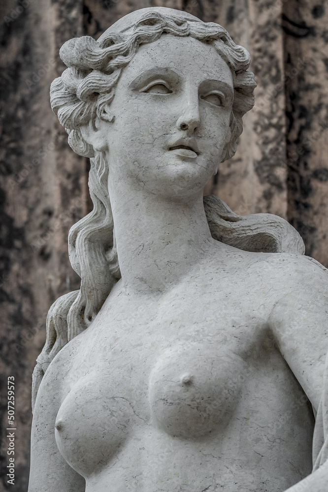 Statue of ancient sensual bathing Renaissance Era woman in Potsdam, Germany, details, closeup.