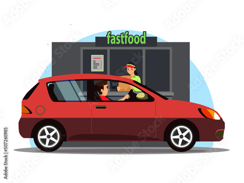 Driver paying for takeaway fast food order at open window of Drive Thru restaurant